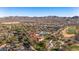Aerial view of community featuring pool, clubhouse, tennis courts, and well-maintained landscaping at 26880 W Sierra Pinta Dr, Buckeye, AZ 85396