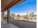 A lovely back patio features paver flooring and desert landscaping with unobstructed views of the golf course at 26880 W Sierra Pinta Dr, Buckeye, AZ 85396