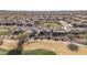 Aerial view showcasing the backyards of homes adjacent to the golf course in a Primary-planned community at 26880 W Sierra Pinta Dr, Buckeye, AZ 85396