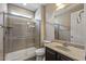 Well-lit bathroom features a glass-enclosed shower, modern fixtures, and a clean design at 26880 W Sierra Pinta Dr, Buckeye, AZ 85396