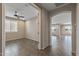 Bedroom with ceramic tile floors, a ceiling fan, and shuttered windows at 26880 W Sierra Pinta Dr, Buckeye, AZ 85396