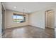 Neutral dining room showcasing tile floors, a modern light fixture, and a large window overlooking the outside at 26880 W Sierra Pinta Dr, Buckeye, AZ 85396