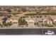 Exterior aerial shot of home showcasing desert landscaping, solar panels, and three-car garage at 26880 W Sierra Pinta Dr, Buckeye, AZ 85396