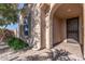 Covered front entrance featuring brick pavers and an arched doorway at 26880 W Sierra Pinta Dr, Buckeye, AZ 85396