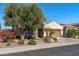 Attractive home exterior with desert landscaping and neutral color scheme at 26880 W Sierra Pinta Dr, Buckeye, AZ 85396
