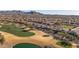 Scenic aerial view of a golf course community with desert landscaping and mountain views in the distance at 26880 W Sierra Pinta Dr, Buckeye, AZ 85396