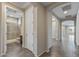 Hallway with ceramic tile floors connecting to a bathroom and other rooms at 26880 W Sierra Pinta Dr, Buckeye, AZ 85396