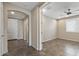 Entryway hallway leading to a bedroom with an arched entry at 26880 W Sierra Pinta Dr, Buckeye, AZ 85396