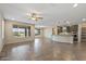 Open concept living room, kitchen and dining area featuring tile floors at 26880 W Sierra Pinta Dr, Buckeye, AZ 85396