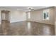 Large living room with tile flooring, neutral walls, and lots of natural light at 26880 W Sierra Pinta Dr, Buckeye, AZ 85396