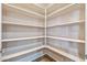 Walk-in pantry with shelving for optimal organization and storage at 26880 W Sierra Pinta Dr, Buckeye, AZ 85396