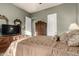 Bedroom featuring a queen bed, dresser, and wardrobe with adjacent doorways at 31409 N 166Th Pl, Scottsdale, AZ 85262