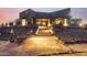 Striking modern home entrance with brick walkway and desert landscaping at 31409 N 166Th Pl, Scottsdale, AZ 85262
