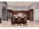 Large open kitchen with granite counters, dark wood cabinets and a stainless steel refrigerator at 31409 N 166Th Pl, Scottsdale, AZ 85262