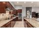 Well-appointed kitchen with granite countertops, stainless steel appliances, and custom wood cabinets at 31409 N 166Th Pl, Scottsdale, AZ 85262