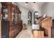 Stately living room featuring an organ and a beautiful china cabinet for displaying treasures at 31409 N 166Th Pl, Scottsdale, AZ 85262