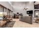 Bright and airy living room with soaring ceilings, a fireplace, and comfortable seating at 31409 N 166Th Pl, Scottsdale, AZ 85262