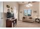 Comfortable living room featuring a cozy couch and a mounted television at 31409 N 166Th Pl, Scottsdale, AZ 85262