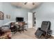 Office featuring a ceiling fan, desk with computer, and a black leather chair at 31409 N 166Th Pl, Scottsdale, AZ 85262