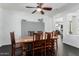 Bright dining room features sleek dark hardwood flooring adjacent to the living room at 3529 E Fandango Dr, Gilbert, AZ 85298