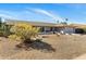 Charming single-story home featuring desert landscaping, decorative cacti, and stone accents in the front yard at 401 E Marconi Ave, Phoenix, AZ 85022