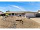 Charming single-story home with a low-maintenance desert landscaped front yard and two-car garage at 401 E Marconi Ave, Phoenix, AZ 85022