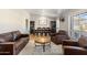 Bright living room with wood floors, comfortable seating, and a dining area, creating an inviting atmosphere at 401 E Marconi Ave, Phoenix, AZ 85022