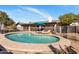 Inviting backyard with a sparkling pool, lounge chairs, and landscaped surroundings, creating a private oasis at 401 E Marconi Ave, Phoenix, AZ 85022