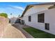 Side yard with a brick walkway and low-maintenance landscaping, offering a clean and functional outdoor space at 401 E Marconi Ave, Phoenix, AZ 85022