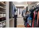 Well-organized walk-in closet with ample storage and shelving space for clothes and accessories at 401 E Marconi Ave, Phoenix, AZ 85022