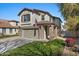 Beautiful home featuring manicured grass, stone accents, and a welcoming facade at 4048 E Constitution Ct, Gilbert, AZ 85296