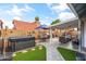 Serene backyard oasis featuring a hot tub, patio, and lush landscaping for relaxation and entertainment at 4121 E Ashurst Dr, Phoenix, AZ 85048