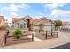 Inviting exterior featuring a well-maintained yard, stone accents, and a convenient three-car garage at 4121 E Ashurst Dr, Phoenix, AZ 85048