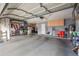 Spacious garage with ample storage space, shelving, and room for parking vehicles at 4121 E Ashurst Dr, Phoenix, AZ 85048