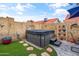 Private backyard hot tub providing a relaxing spa experience, surrounded by greenery and a block wall at 4121 E Ashurst Dr, Phoenix, AZ 85048