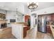 Spacious kitchen with stainless steel appliances, granite countertops, and a large island at 4121 E Ashurst Dr, Phoenix, AZ 85048