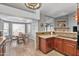 Open kitchen design with granite countertops, mosaic backsplash, and eat-in breakfast nook at 4121 E Ashurst Dr, Phoenix, AZ 85048