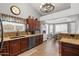 Bright kitchen featuring granite countertops, stainless steel appliances, and adjacent dining area at 4121 E Ashurst Dr, Phoenix, AZ 85048