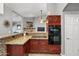 Kitchen area showcasing granite countertops, modern appliances, and ample cooking space at 4121 E Ashurst Dr, Phoenix, AZ 85048
