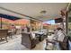 Covered patio featuring comfortable seating and outdoor entertaining space, complete with a BBQ area and pool at 4121 E Ashurst Dr, Phoenix, AZ 85048