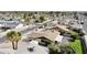 A residential neighborhood with palm trees, desert landscaping, and multiple single-Gathering homes from an aerial perspective at 5123 E Beck Ln, Scottsdale, AZ 85254