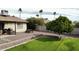 Lush backyard featuring a grassy area and a picnic table, perfect for relaxing or entertaining outdoors at 5123 E Beck Ln, Scottsdale, AZ 85254