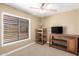 Simple bedroom featuring a tv and natural light at 5123 E Beck Ln, Scottsdale, AZ 85254