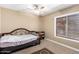 Bright bedroom with a twin bed and a large window offering plenty of natural light at 5123 E Beck Ln, Scottsdale, AZ 85254