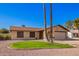 Charming single-story home featuring desert landscaping, a two-car garage and neutral toned exterior paint at 5123 E Beck Ln, Scottsdale, AZ 85254