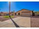 Charming single-story home featuring desert landscaping, a two-car garage and neutral toned exterior paint at 5123 E Beck Ln, Scottsdale, AZ 85254