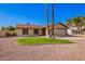 Charming single-story home featuring desert landscaping, a two-car garage and neutral toned exterior paint at 5123 E Beck Ln, Scottsdale, AZ 85254