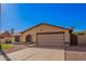 Charming single-story home featuring desert landscaping, a two-car garage and neutral toned exterior paint at 5123 E Beck Ln, Scottsdale, AZ 85254
