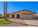 Charming single-story home featuring desert landscaping, a two-car garage and neutral toned exterior paint at 5123 E Beck Ln, Scottsdale, AZ 85254