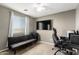 Bedroom featuring a gaming setup, ceiling fan and neutral carpet at 5145 W Odeum Ln, Phoenix, AZ 85043